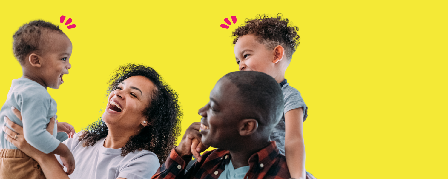 A man and woman are pictured with two small children