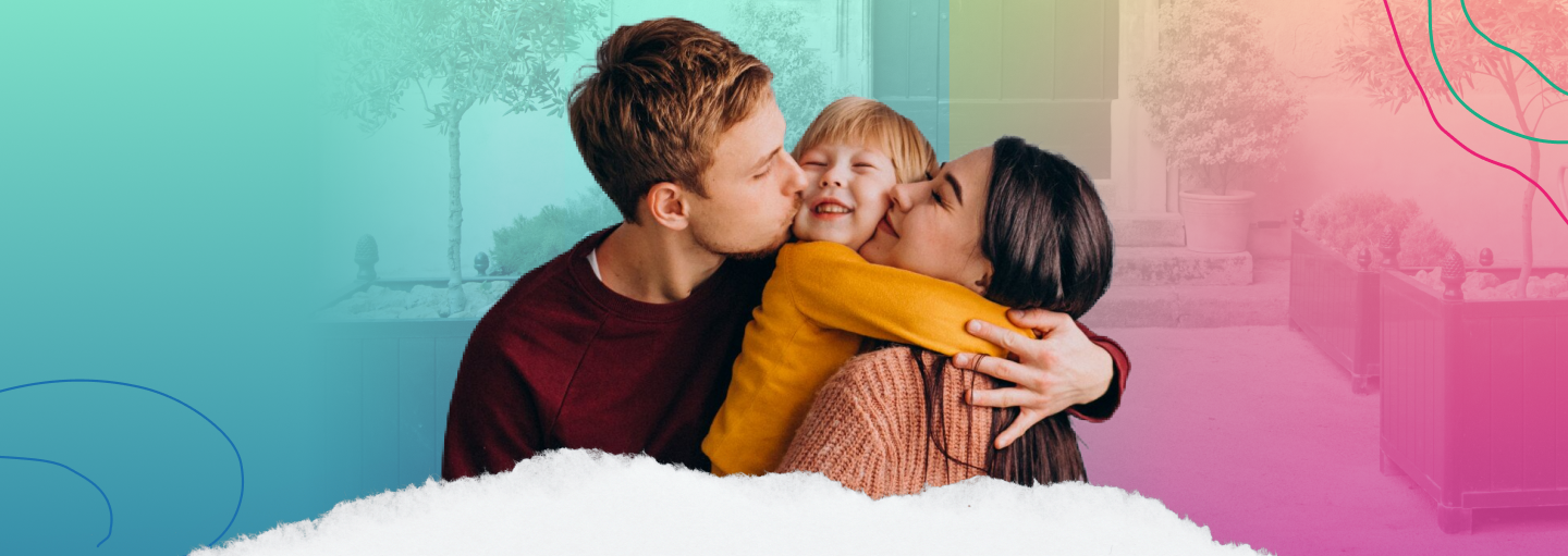 Man and woman kissing child's cheeks